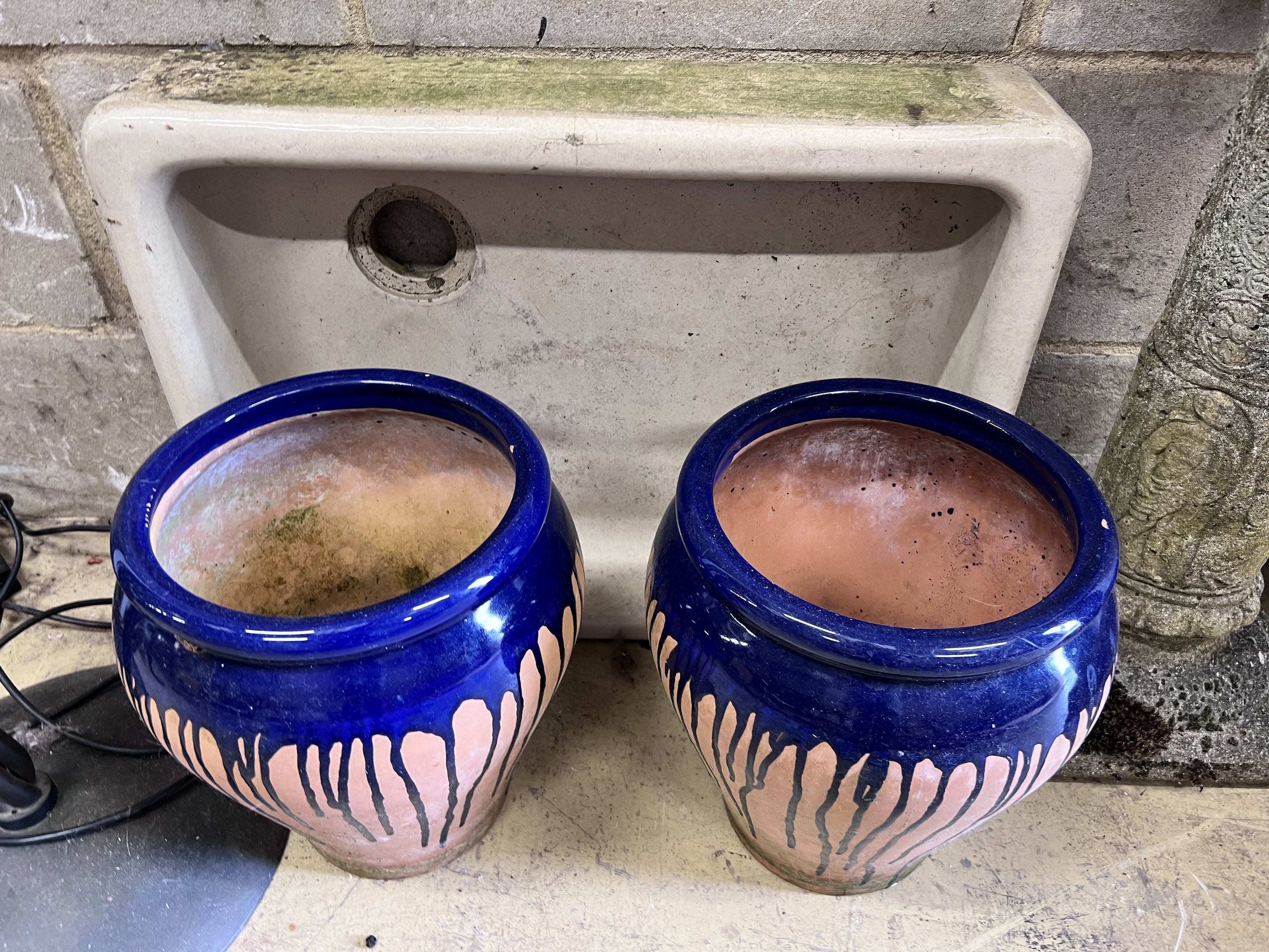 A pair of reconstituted stone garden planters, a sun dial, pair of terracotta pots and a sink